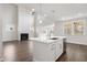 Open concept kitchen and living room with two-story high ceilings and fireplace at 6300 Misty Hill Ln, Buford, GA 30518
