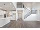 Two-story living room with hardwood floors, fireplace and open staircase at 6300 Misty Hill Ln, Buford, GA 30518