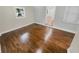 Hardwood floors and neutral color palette in this bedroom at 1955 S Columbia Pl, Decatur, GA 30032