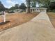 House with a long driveway and a front yard with sparse grass at 1955 S Columbia Pl, Decatur, GA 30032