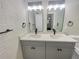Double vanity bathroom with updated fixtures and white subway tile at 1955 S Columbia Pl, Decatur, GA 30032