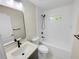 Modern bathroom with white subway tile, a bathtub, and updated fixtures at 1955 S Columbia Pl, Decatur, GA 30032