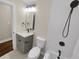 Updated bathroom with gray vanity, modern fixtures and white tile at 1955 S Columbia Pl, Decatur, GA 30032