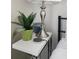 White nightstand with lamp, plant, and smart speaker at 3242 Bonway Dr, Decatur, GA 30032