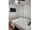 Bedroom with TV, ceiling fan, and patterned curtains at 3242 Bonway Dr, Decatur, GA 30032