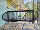 Cozy front porch with two black metal chairs and small table at 3242 Bonway Dr, Decatur, GA 30032
