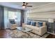Living room features a neutral sofa, accent chair, and hardwood floors at 3242 Bonway Dr, Decatur, GA 30032