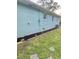Side yard with newly installed landscaping and brick border at 3242 Bonway Dr, Decatur, GA 30032