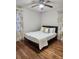 Bedroom with queen bed, hardwood floors, and yellow curtains at 3242 Bonway Dr, Decatur, GA 30032