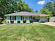 Ranch style home with a freshly painted exterior and well-maintained lawn at 3242 Bonway Dr, Decatur, GA 30032