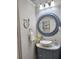 Elegant bathroom with a round vanity mirror and vessel sink at 3242 Bonway Dr, Decatur, GA 30032