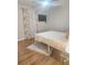 Bright bedroom with wood floors, featuring a comfortable bed and stylish curtains at 3242 Bonway Dr, Decatur, GA 30032