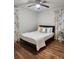 Bright bedroom with a queen-size bed and hardwood floors at 3242 Bonway Dr, Decatur, GA 30032