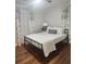 Bedroom with a queen bed, ceiling fan and patterned curtains at 3242 Bonway Dr, Decatur, GA 30032