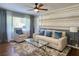 Living room with neutral sofa, accent chair, and hardwood floors at 3242 Bonway Dr, Decatur, GA 30032