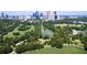 Aerial view of park with pond and cityscape in background at 1858 Windemere Ne Dr, Atlanta, GA 30324