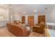 Spacious bonus room with leather furniture and built-in shelving at 1170 Lowell Rd, Carrollton, GA 30116