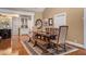 Elegant dining room with hardwood floors and view into kitchen at 1170 Lowell Rd, Carrollton, GA 30116