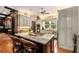 Spacious kitchen with granite island, custom cabinetry, and stainless steel appliances at 1170 Lowell Rd, Carrollton, GA 30116