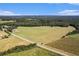 Aerial view of large property with barn at 1170 Lowell Rd, Carrollton, GA 30116