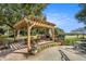Outdoor kitchen with stone fireplace and built-in grill at 1170 Lowell Rd, Carrollton, GA 30116