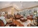 Open living room with hardwood floors, vaulted ceiling, and access to back porch at 1170 Lowell Rd, Carrollton, GA 30116