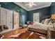 Charming bedroom with a jungle mural and hardwood floors at 1170 Lowell Rd, Carrollton, GA 30116