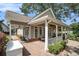 Covered porch with brick flooring and white railings at 1170 Lowell Rd, Carrollton, GA 30116