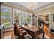 Home office with hardwood floors, built-ins, and large windows at 1170 Lowell Rd, Carrollton, GA 30116