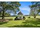 White gazebo in a large backyard, offering scenic views at 1170 Lowell Rd, Carrollton, GA 30116