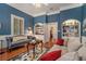 Spacious living room featuring hardwood floors, built-in shelving, and a stone fireplace at 1170 Lowell Rd, Carrollton, GA 30116