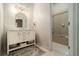 Bathroom with white vanity, marble countertop, and shower/tub combo at 1170 Lowell Rd, Carrollton, GA 30116