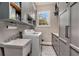 Bright laundry room with built-in cabinets and sink at 1170 Lowell Rd, Carrollton, GA 30116