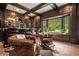 Home bar with leather seating and brick flooring at 1170 Lowell Rd, Carrollton, GA 30116