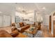 Open living area featuring a kitchen and comfortable leather seating at 1170 Lowell Rd, Carrollton, GA 30116