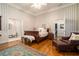 Bright bedroom with hardwood floors and ensuite bathroom access at 1170 Lowell Rd, Carrollton, GA 30116