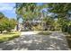 Ranch style home with a long driveway and mature trees at 1170 Lowell Rd, Carrollton, GA 30116