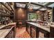 Home bar with granite countertop and wine cooler at 1170 Lowell Rd, Carrollton, GA 30116