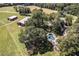 Aerial view of home, pool and large property at 1170 Lowell Rd, Carrollton, GA 30116