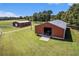 Two barns and a large grassy area at 1170 Lowell Rd, Carrollton, GA 30116
