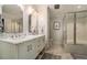 Bathroom with double vanity, marble countertop, and large shower at 1170 Lowell Rd, Carrollton, GA 30116