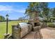 Stone outdoor kitchen with built-in grill, fireplace, and ample counter space at 1170 Lowell Rd, Carrollton, GA 30116