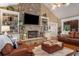 Spacious living room with stone fireplace, built-in shelving, and hardwood floors at 1170 Lowell Rd, Carrollton, GA 30116