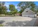 Three-car garage with circular driveway, offering ample parking space at 1170 Lowell Rd, Carrollton, GA 30116