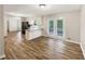 Bright dining area with wood-look flooring and access to the kitchen at 134 Mallet Way, Stockbridge, GA 30281