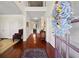 Two-story foyer with hardwood floors, elegant decor, and a view to the backyard at 4550 Fernbrook Pl, Cumming, GA 30040