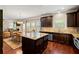 Island kitchen with granite countertops and stainless steel appliances at 4550 Fernbrook Pl, Cumming, GA 30040
