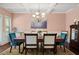 Elegant dining room featuring a wood table and coffered ceiling at 4550 Fernbrook Pl, Cumming, GA 30040
