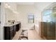 Elegant bathroom with double vanity, soaking tub, and walk-in shower at 4550 Fernbrook Pl, Cumming, GA 30040
