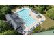 Community swimming pool with lounge chairs and a spray feature at 4550 Fernbrook Pl, Cumming, GA 30040